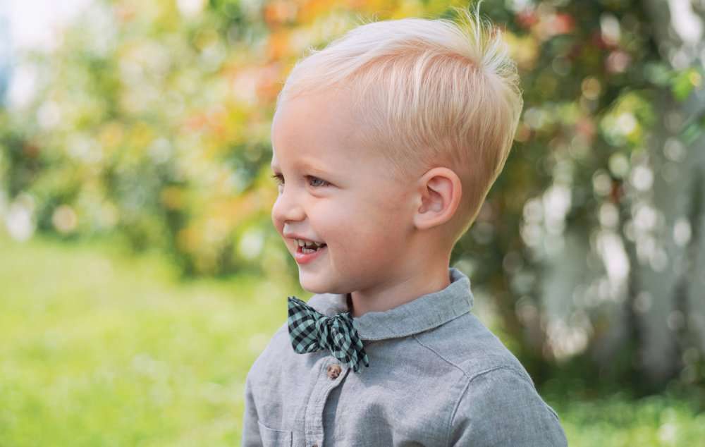 Happy little boy having fun in the park.