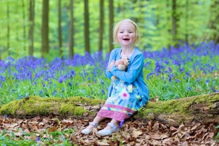 Happy little girl spending time in the park