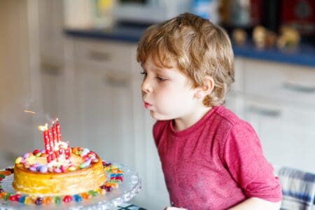 nephew celebrating his birthday blowing out candles