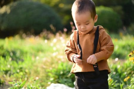 Little Chinese boy playing in the park