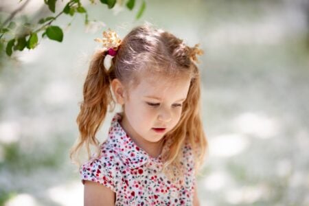 Adorable little girl spending time outdoors