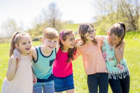 Group of kids having fun on a field