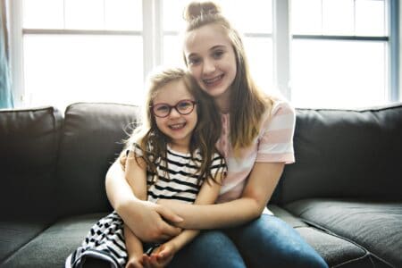 Two sisters hugging celebrating birthday