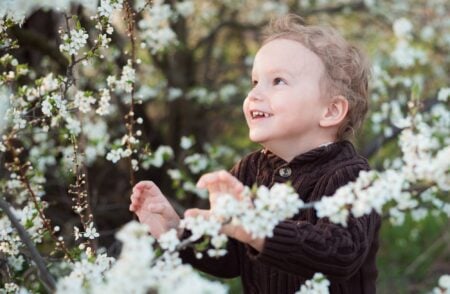 Cute little boy playing in the garden