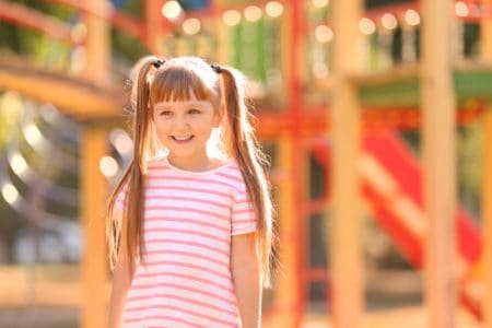 Cute little girl playing outdoors