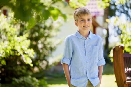 Smiling little boy spending time in the garden