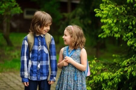 Two students talking to each other at the park