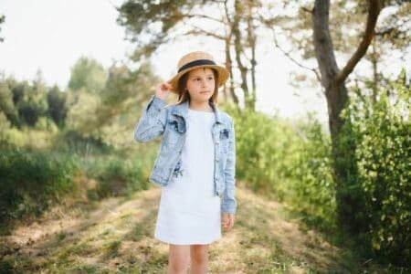 Cute child girl with hat in the park