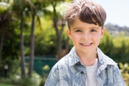 Cute little boy playing outdoors