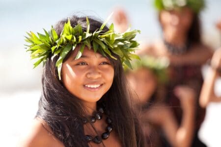 Cute maori girl spending time on the beach