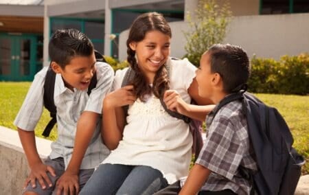 Mexican siblings having fun outdoors