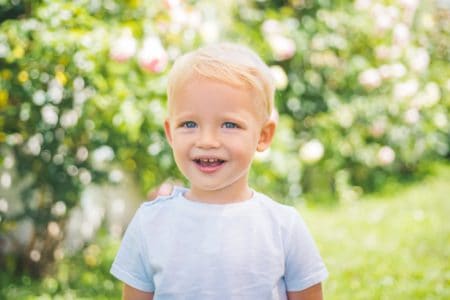 Happy little boy spending time outdoors