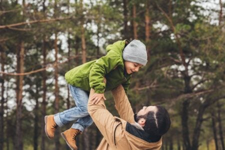 A father holding his son.