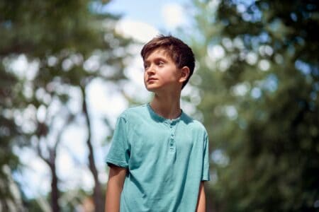 Young teenage boy spending time in the park