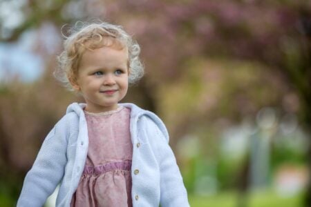 Cute little girl spending time in the park