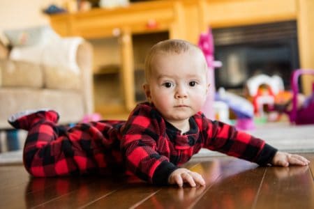 Little Scottish boy playing in his room