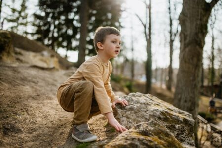 Adorable little boy playing at the park