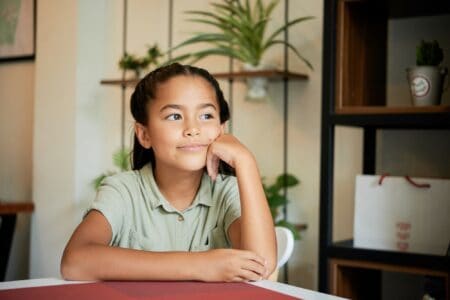 Vietnamese girl sitting inside a cozy cafe