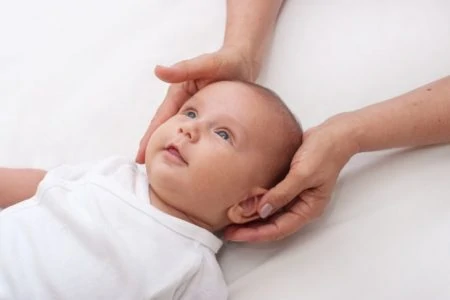 Young baby boy shaking his head