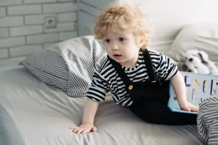 Toddler reading a book