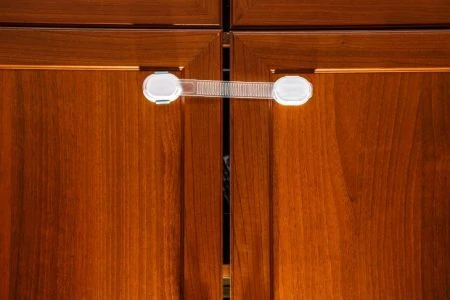 Safety plastic lock on cabinet for child protection