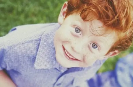 Happy and smiling Gaelic boy in the park