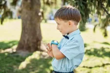 Young boy with gps smartwatch