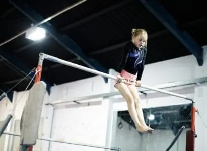 Young gymnast on a gymnastics horizontal bar