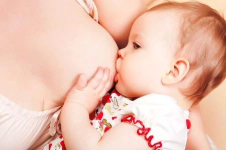 New mother breastfeeding her baby