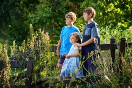 Three siblings spending time together in the garden