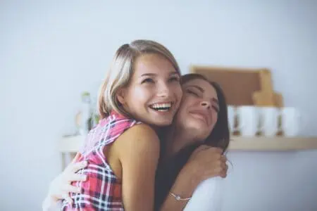 Two best friends hugging celebrating birthday with wishes