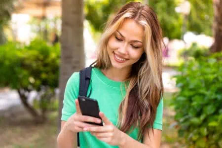 Ex-girlfriend receiving a happy birthday message on her phone