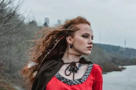 Beautiful Celtic girl looking at the ocean