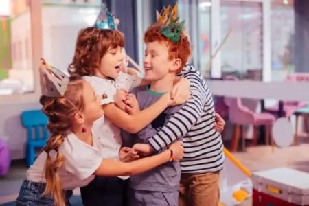 Kids laughing and playing classic party games together