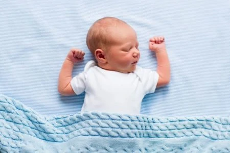 Baby sleeping on his back