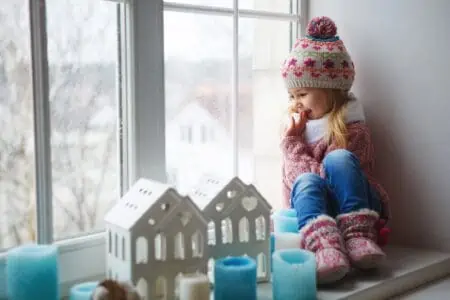 Cute Danish girl looking out the window