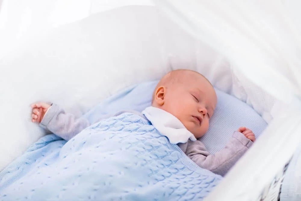 Baby sleeping in a bassinet