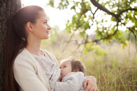 Woman breastfeeding frustrated with low milk supply