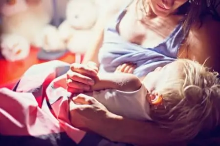 A woman breastfeeding her baby