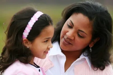 Mother talking and encouraging daughter