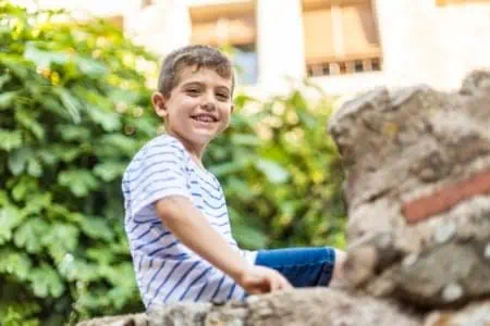 Happy little boy spending time outdoors on a sunny day