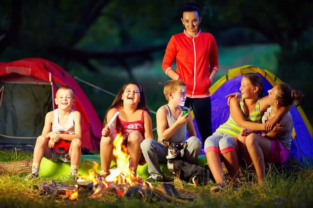 scary woman standing behind kids