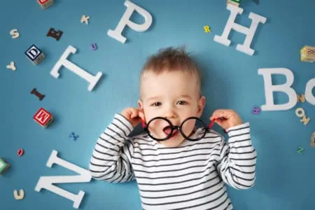 Cute baby boy wearing glasses