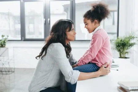 Mom talking to her daughter.