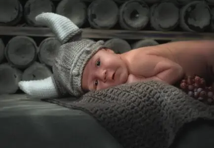 Child wearing a viking helmet